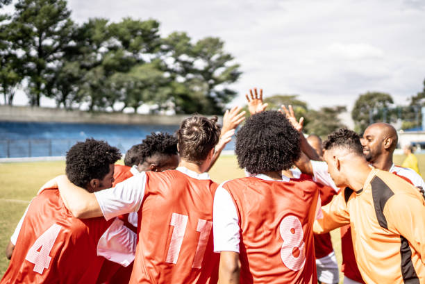 istock Soccer team players huddling before match starts 1398380547