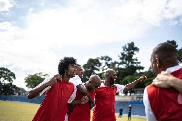 istock Soccer players celebrating a goal 1398380559