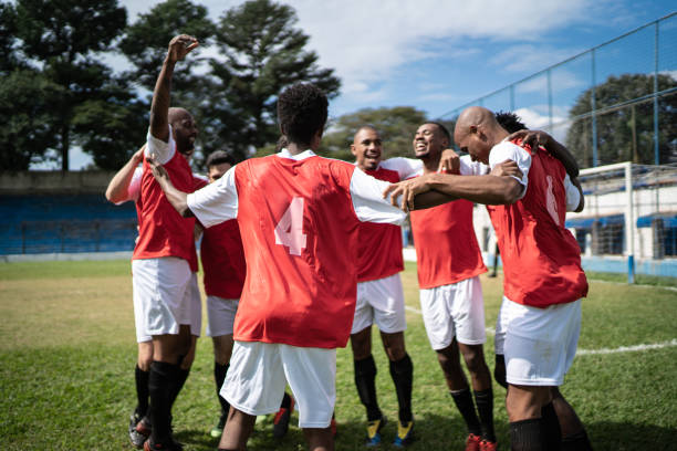 istock Soccer players celebrating a goal 1398380563
