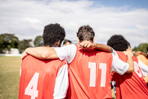istock Soccer team players huddling before match starts 1398380567