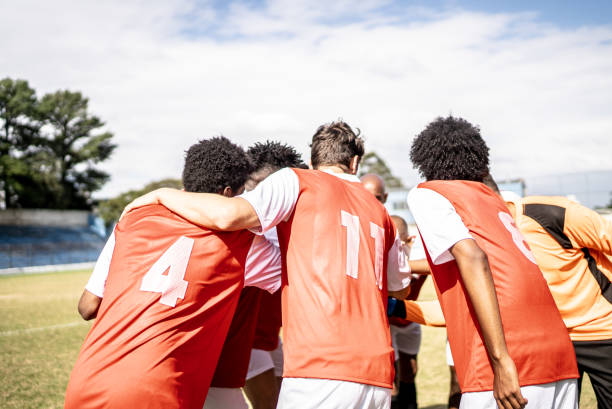 istock Soccer team players huddling before match starts 1398380575