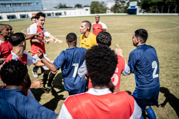 istock Soccer players complaining to referee during match 1398380586