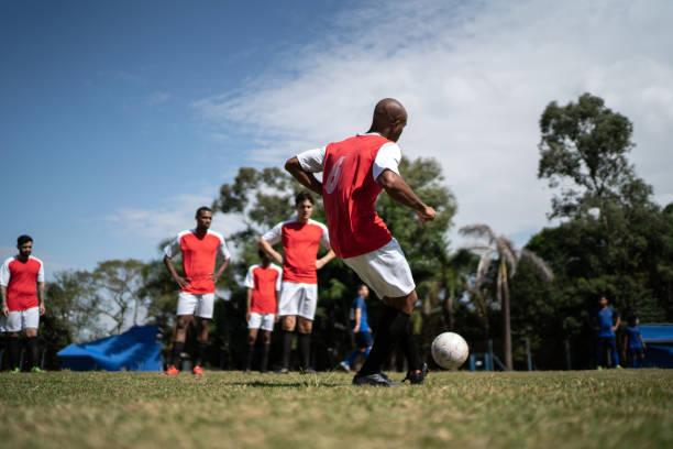 istock Soccer players training on soccer field 1398380599
