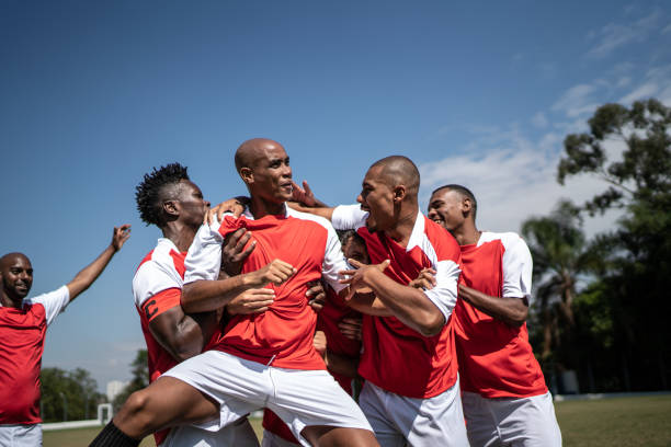 istock Soccer players celebrating a goal 1398380602