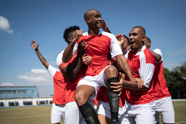 istock Soccer players celebrating a goal 1398380605
