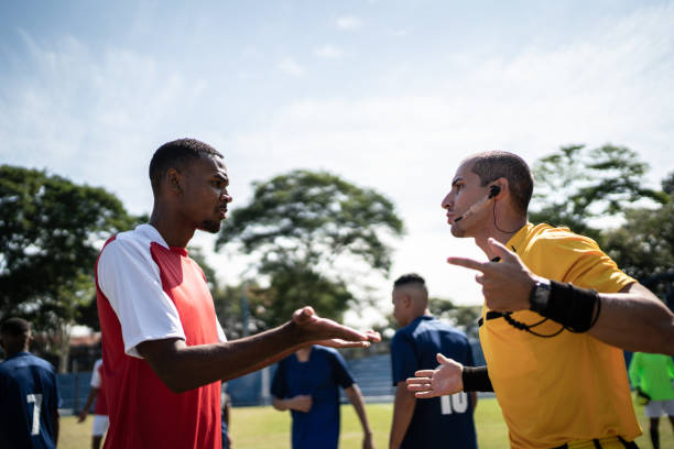 istock Soccer player complaining to referee during match 1398380610