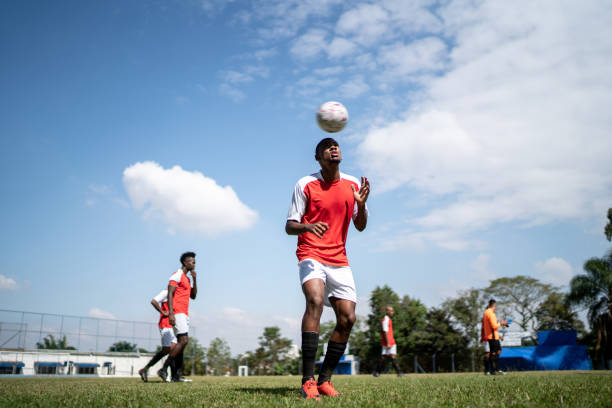 istock Soccer player doing kick ups on the field 1398380680