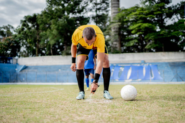 istock Referee marking the position ball for a free kick 1398380773