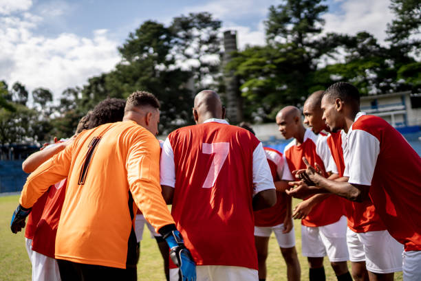 istock Soccer team players huddling before match starts 1398380813