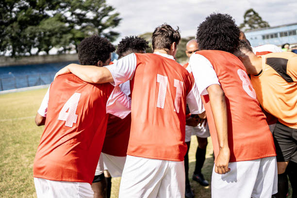 istock Soccer team players huddling before match starts 1398380818