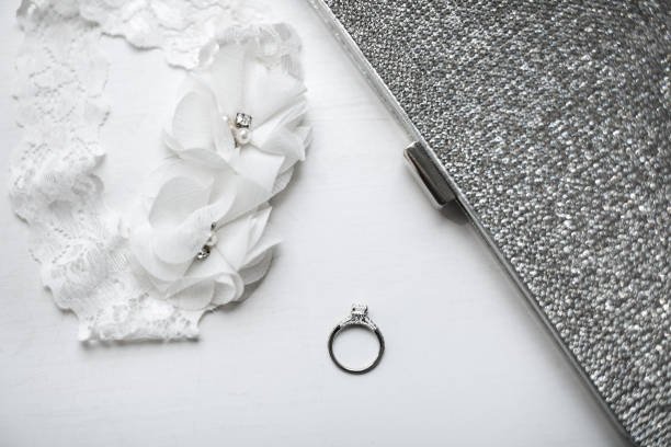 istock Wedding ring with garter on white background 1398380854