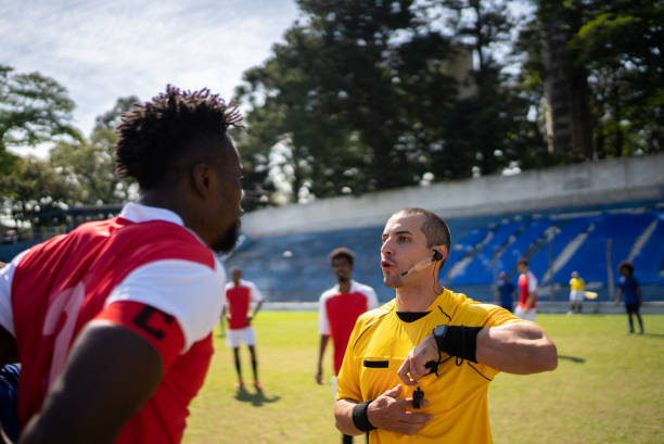 istock Soccer players complaining with referee during the match 1398380953