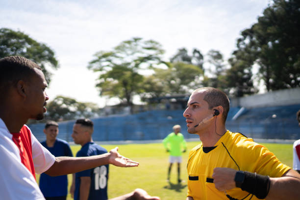 istock Soccer players complaining with referee during the match 1398380983
