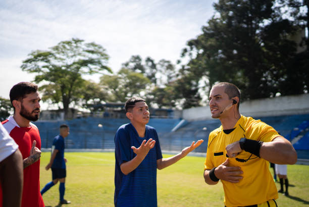 istock Soccer players complaining with referee during the match 1398380991