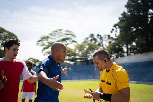 istock Soccer players complaining with referee during the match 1398381001
