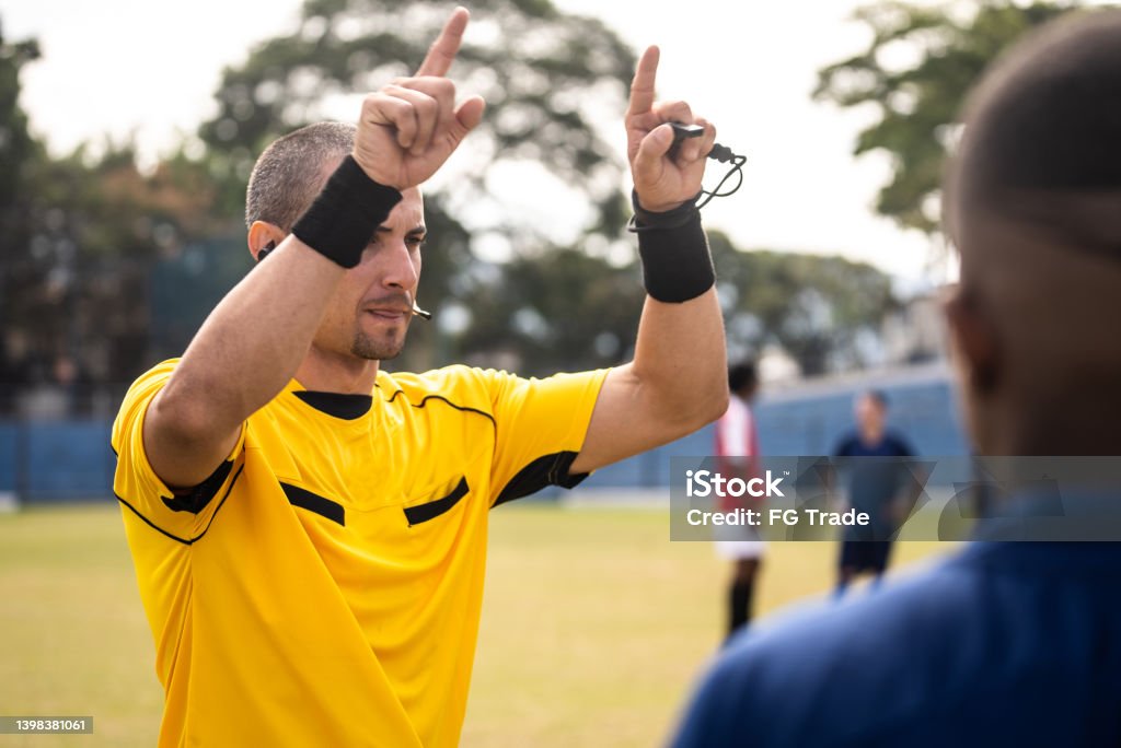 Referee gesturing to check VAR Var Stock Photo