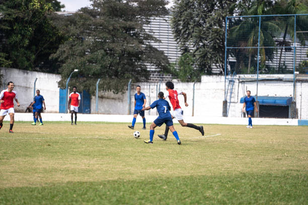 istock Soccer teams playing soccer match 1398381076