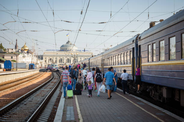 Odessa, Ukraine - September 7, 2016: People disembark a train in Odessa at the end of an overnight journey from Lviv.