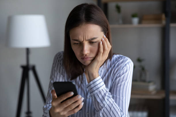 istock Frustrated annoyed smartphone user upset about problems with mobile phone 1398385342