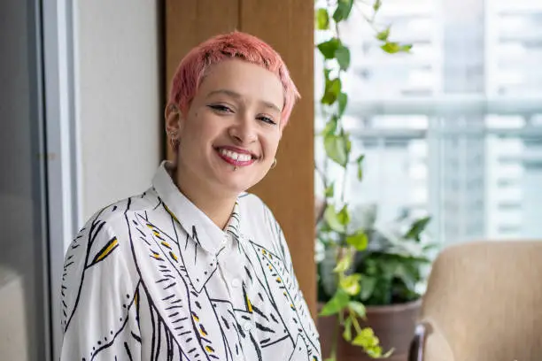 Photo of Portrait of a non-binary person with dye hair