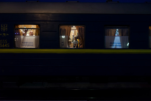 Lviv, Ukraine - September 6, 2016: Passengers are seen through a train window shortly before their train departs on the overnight journey from Lviv to Odessa.