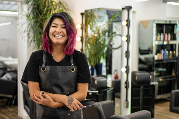 Portrait of hairdresser with dye hair at hair salon Portrait of hairdresser with dye hair at hair salon pink hair stock pictures, royalty-free photos & images