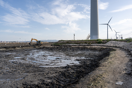 Beaches, windmills and excavators parked