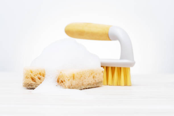 istock Sponge with soap sud washing the tile. Cleaning concept. 1398392129