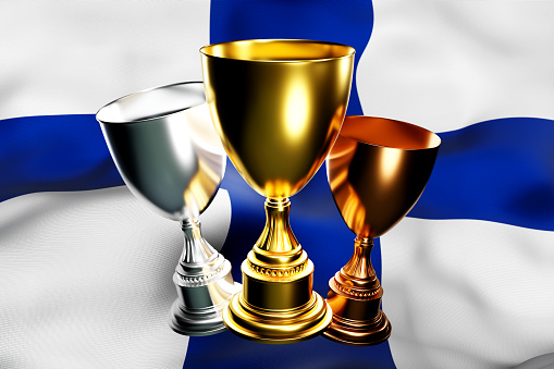 3d illustration of a cup of gold, silver and bronze winners on the background of the national flag of Finland. 3D visualization of an award for sporting achievements