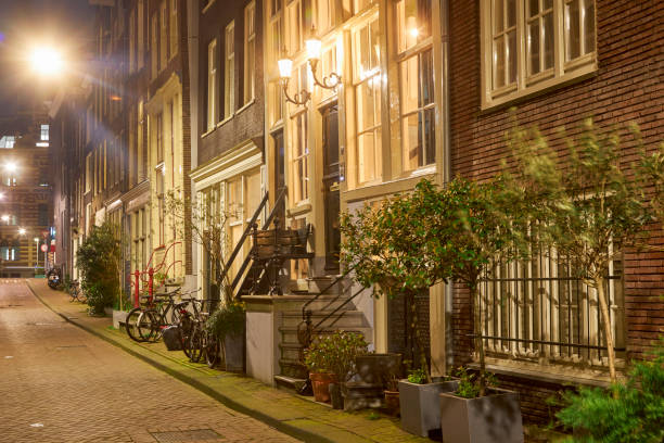 istock Amsterdam city street at night 1398394850