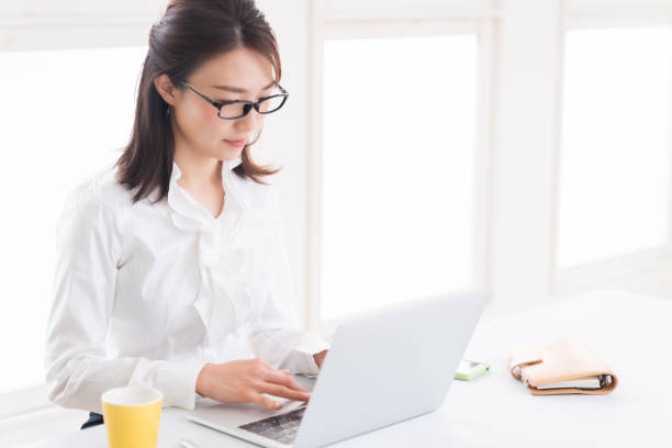 istock young asian woman using laptop 1398397739