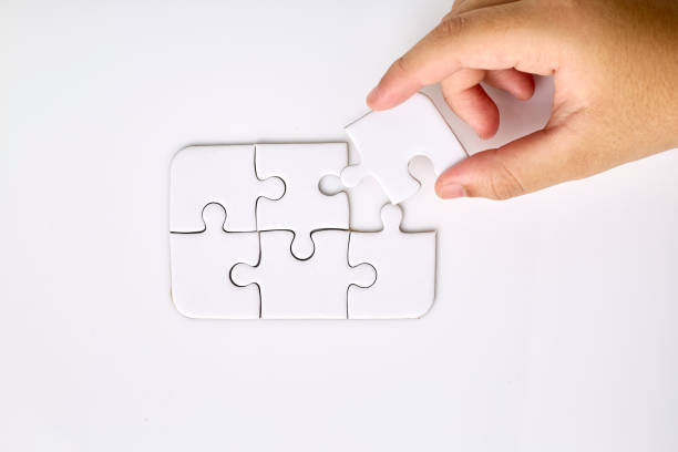 istock Girl holding jigsaw puzzle with a missing piece 1398398518