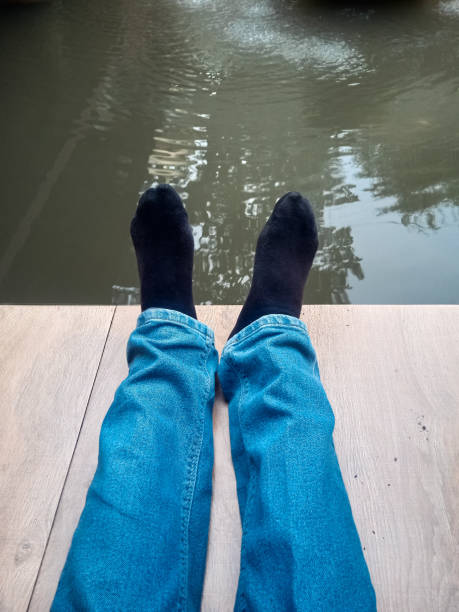 istock relax in front of the fish pond 1398400733