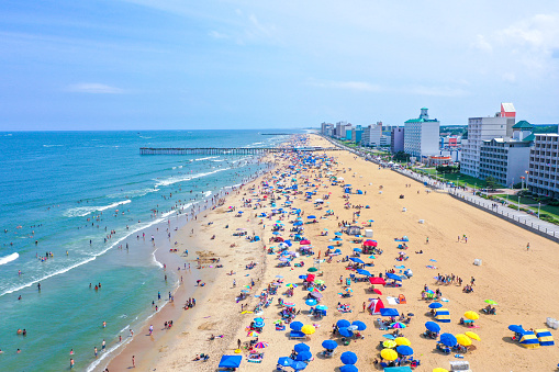 Virginia Beach  Virginia - July 4 2021: Aerial view of the Virginia Beach oceanfront looking south on a busy holiday weekend with a large crowd of people