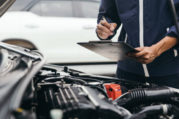 automobile mechanic repairman hands repairing a car engine automotive workshop with a wrench, car service and maintenance,repair service. - motor vehicle imagens e fotografias de stock