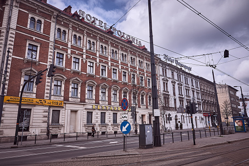 Krakow, Poland - March 25, 2014 : View of pedestrian walking on sidewalk