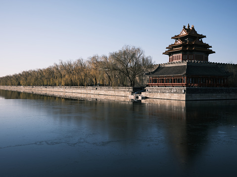 Beijing, China - December 3rd, 2021 -  A corner of the Forbidden City (the Palace museum) in Beijing. The palace is surrounded by a deep moat.