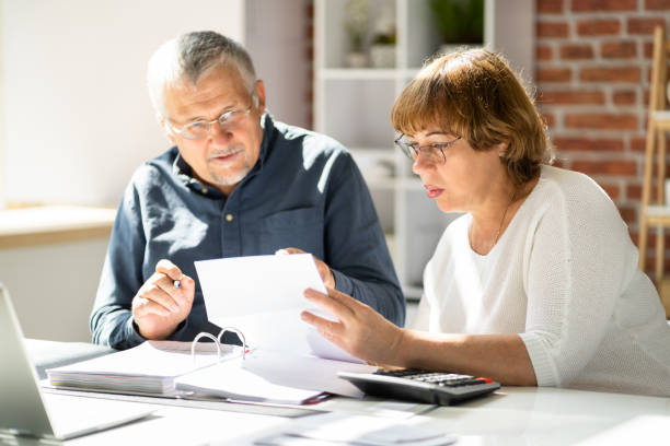 istock Senior Couple With Letter 1398412782