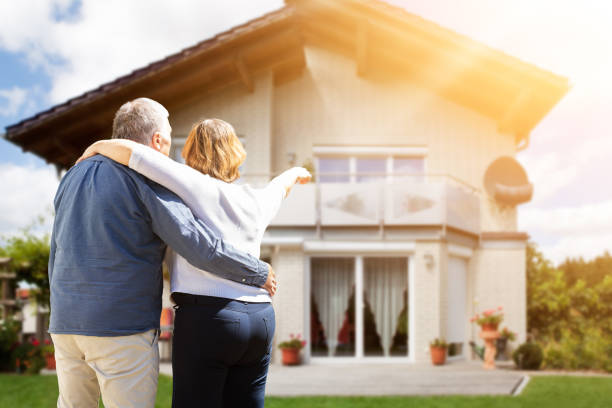 istock Rear View Of Couple Pointing Finger 1398413008