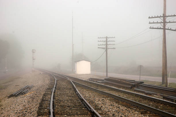 istock Trains - Merging Tracks in Morning Fog 1398413969