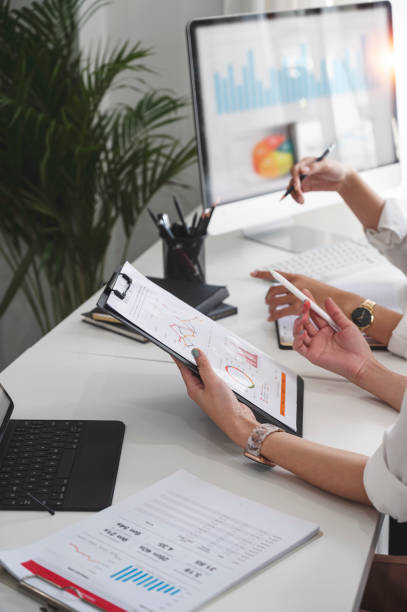 istock Businesspeople working at office with tablet and document on his desk, doing planning analyzing the financial report, business plan investment, finance analysis concept. Economic business discussions. 1398414794