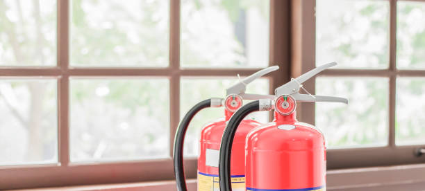 istock The red fire extinguisher is ready for use in case of an indoor fire emergency. 1398419147