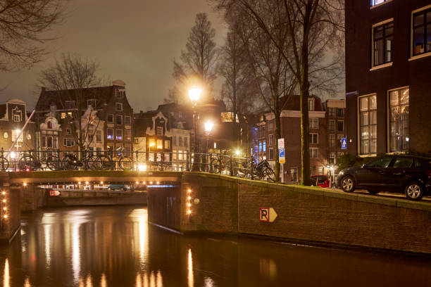 istock Amsterdam canal bridge at night 1398425790