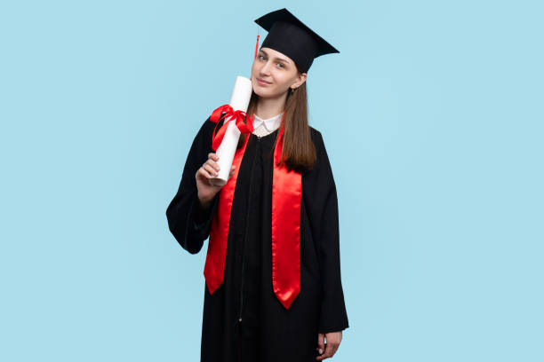 istock Female student with graduation hat and diploma 1398429107
