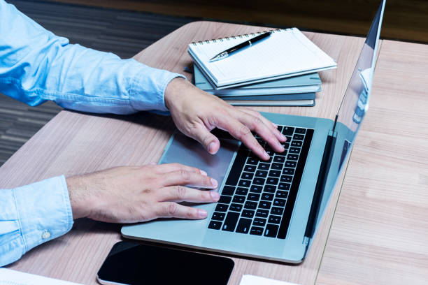 istock Businessman hand pressing keyboard laptop 1398429992