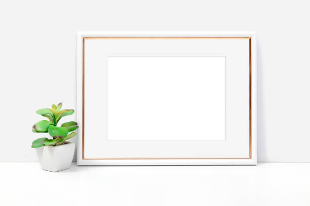 istock Horizontal white and gold frame on a light background with a flower 1398431785