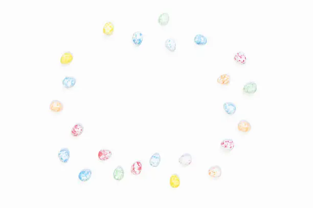Multi-colored Easter eggs on a white background. Background for your spring design.