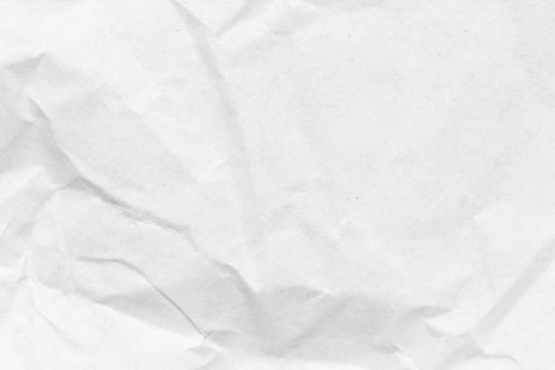 istock Grunge wrinkled white color paper textured background 1398432050
