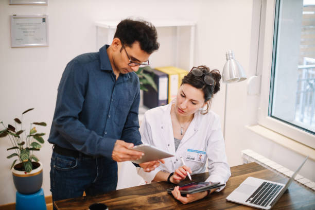 istock colleagues discussing work in the medical office 1398432245