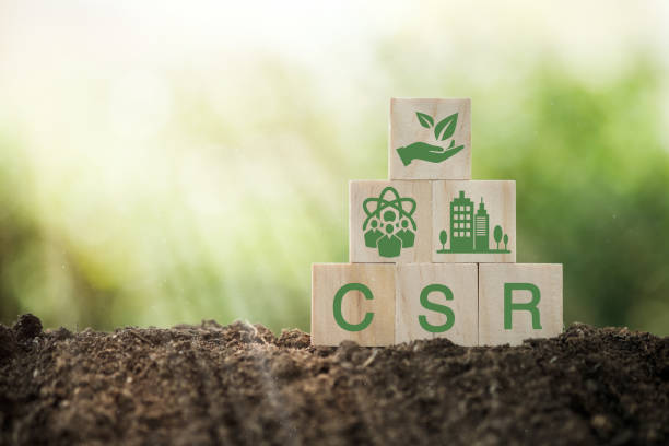 istock CSR Corporate Social Responsibility, CSR and Sustainability Responsible Office. Wooden cube with the CSR icon of natural resource, production, product, usage, reuse and recycling standing. 1398433227